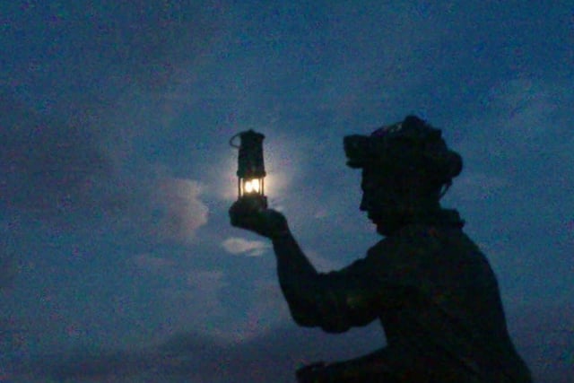 Jo Alvey sent us this photo of the full moon captured through the Davy lamp of the Testing for Gas statue at Silverhill Wood in Sutton
