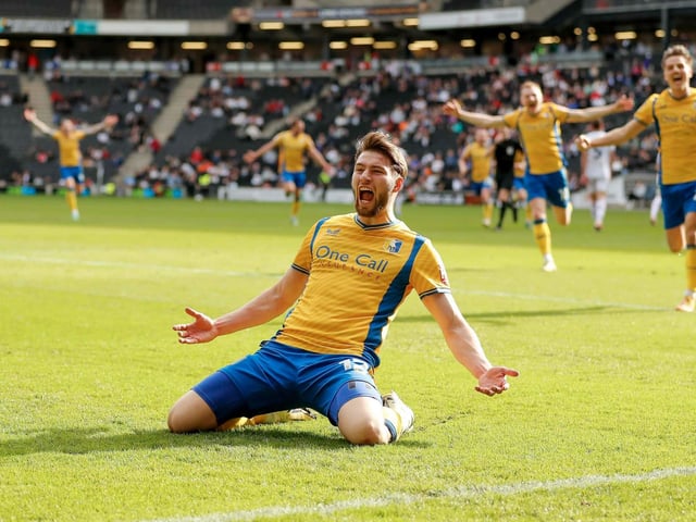 James Gale scores late in the crucial 4-1 win at MK Dons in April.