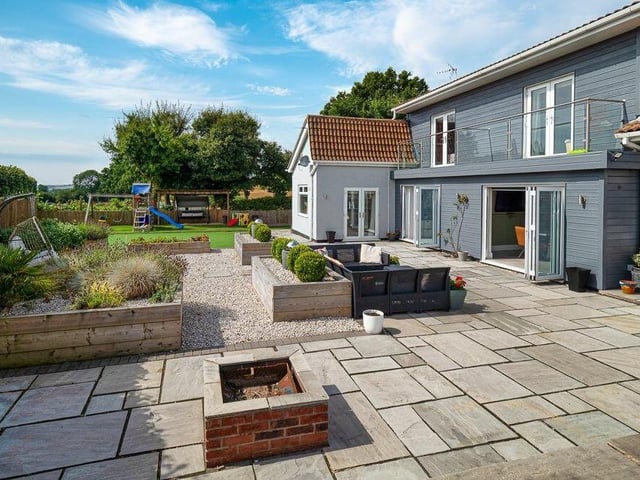 This shot gives an external view of the bedroom balconies on the first floor of the £600,000-plus Selston property. It also shows the doors that open from the open-plan kitchen, reception room or office and living room on to the garden.