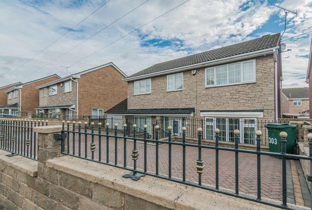 This four bedroom house has a large family conservatory.