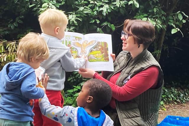 Annie Parry reading to children