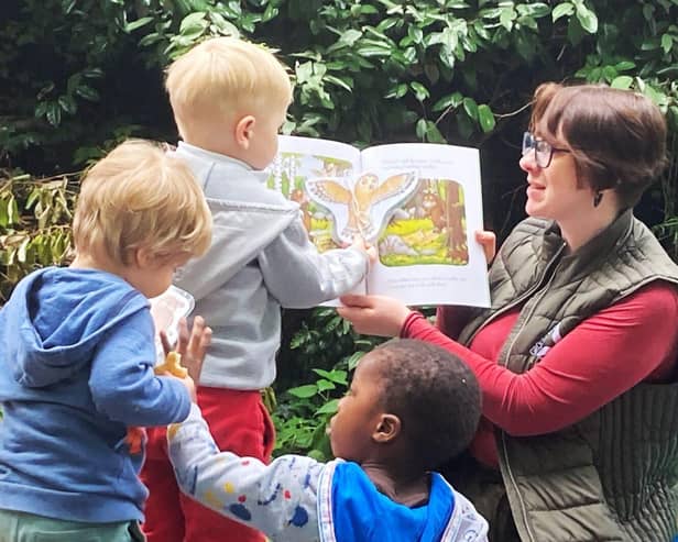 Annie Parry reading to children