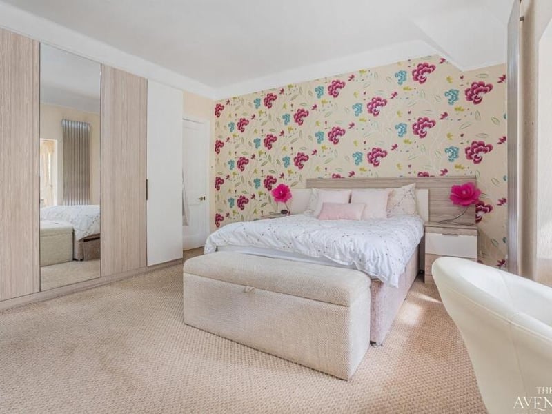 This bedroom is blessed with a terrific amount of wardrobe space.