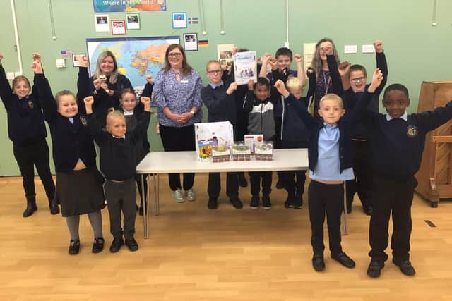 Abbey Hill Primary and Nursery School were presented with a trophy and prize hamper by Vicki Collins, the Library customer service adviser
