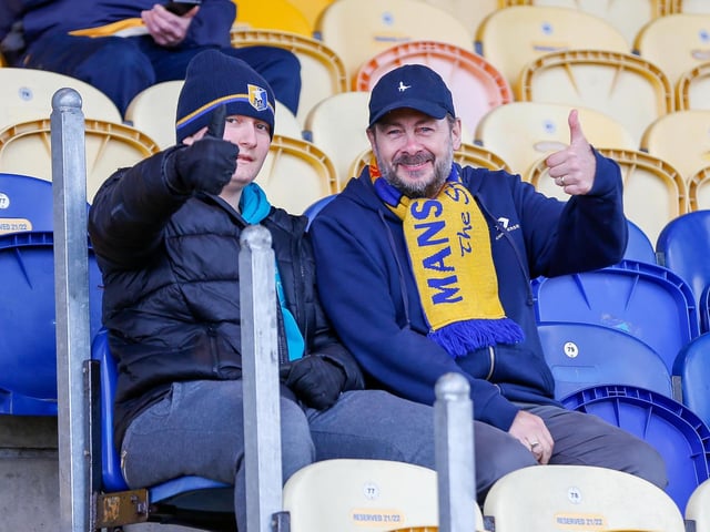Mansfield Town fans watch the match against Northampton Town.