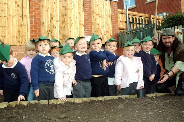Foundation pupils at Robin Hood Primary School meet up with Sherwood Forest legend Robin Hood when he visited the Mansfield Woodhouse School with a sapling from the Major Oak. Year: 2007
