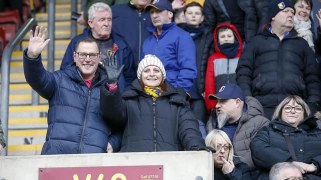 Travelling Stags fans watch the Sky Bet League 2 match against Bradford City.