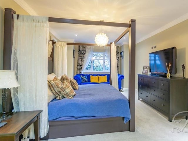 And so the magnificent master bedroom at the £625,000-plus Mansfield property. It's a double with a carpeted floor, fitted wardrobe, en suite bathroom, downlights and a window overlooking the back of the house.