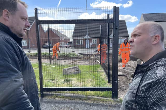 Coun Jason Zadrozy and Coun Kier Barsby look on as workers complete the new cycle and footpath in Sutton