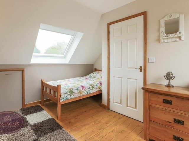 This is the last of the five bedrooms at the Middlebrook Road house. It features integrated eaves storage and Velux windows providing views of the surrounding countryside.
