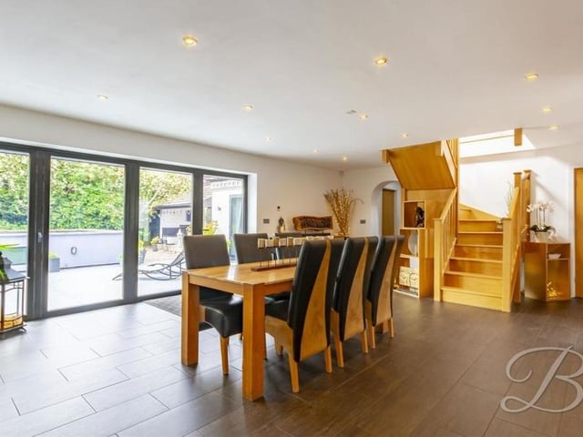 This photo shows the terrific view from the dining area through the bi-folding doors. The stairs lead to the first floor.