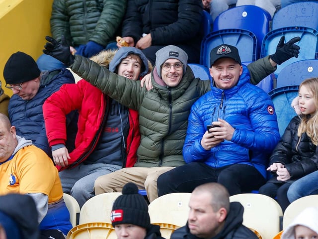 Mansfield Town fans at the One Call Stadium for the Emirates FA Cup third round match against Middlesbrough.