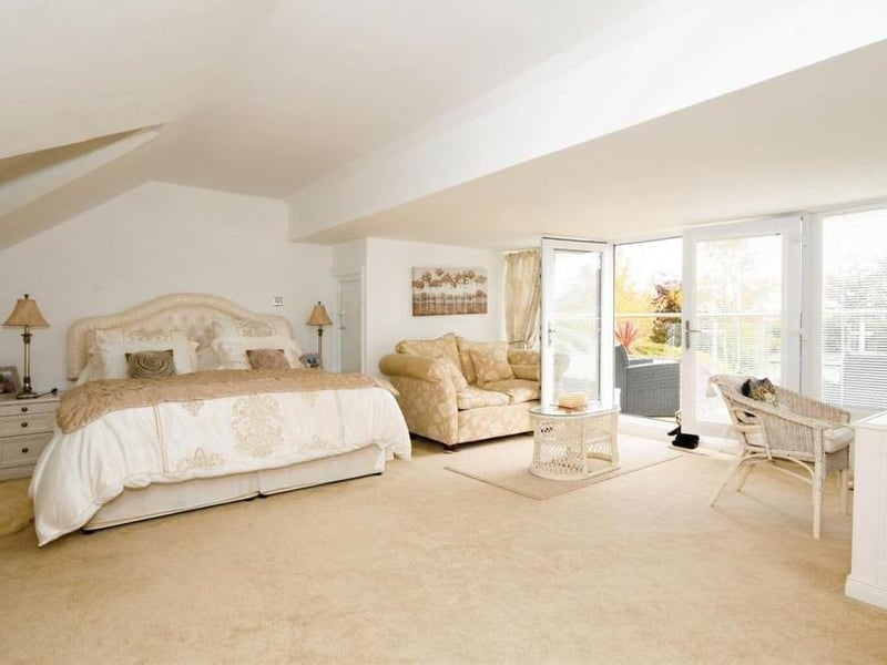 The master bedroom sits on the first floor. A marvellous open-plan space, it has an en suite bathroom, dressing area and balcony overlooking the back garden.