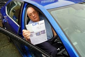 Les Sharp from Mansfield Woodhouse seen holding his parking ticket.