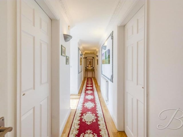 The entrance hallway, which runs the length of most of the bungalow and links almost all of the rooms.