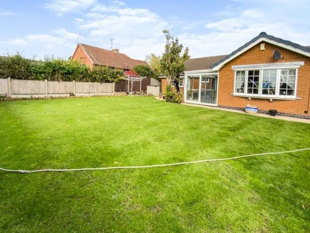 The fantastic garden at the back of the property includes this lovely lawn and has bags of potential.