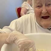 Resident Glenda enjoying making the Matzah Bread