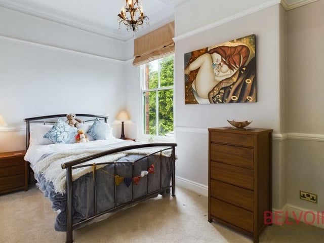 The third bedroom doesn't let the side down when it comes to character and style. It has a sash window facing the back of the property, a dado rail, picture rail and chandelier.