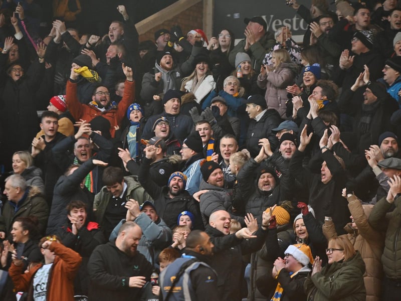 Mansfield Town fans watch the brilliant win at Peterborough United.