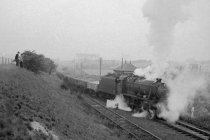 This steam train is taking a sand shipment consisting of 50 wagons from Mansfield to Sweden in 1963.