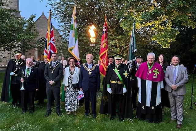 The group at the beacon lighting including Reverend Kevin Charles and Commander of King Offa, Chevalier Mario Rizzardi.