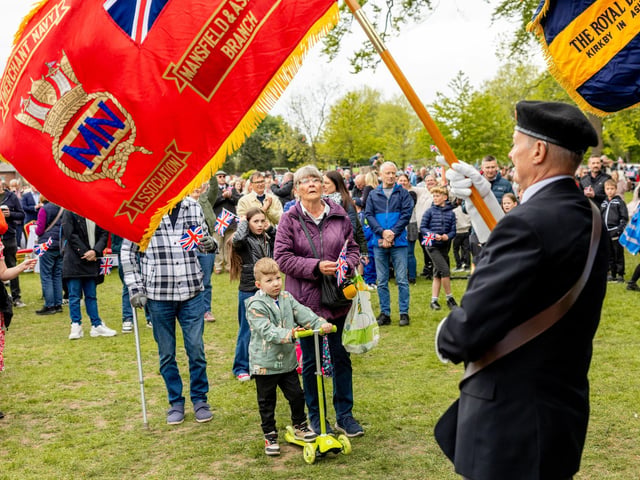 Standard bearers stood to attention for the National Anthem as the park was filled with song.