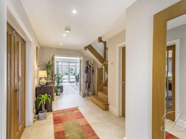 There is a welcoming and spacious reception hallway featuring a tiled floor, ceiling inset spotlights and a useful understairs storage cupboard. The staircase rises to the first floor accommodation. There is also access to the downstairs cloakroom.