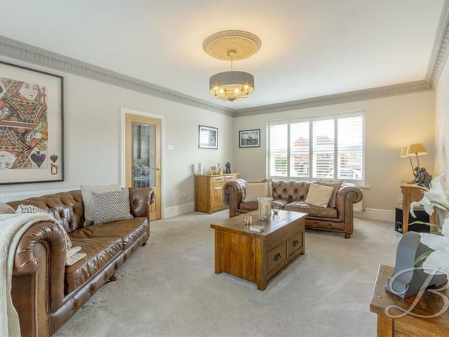 Traditional features in the classy lounge include coving and also a ceiling rose, which adds character.