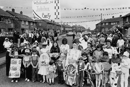 Adults and kids take over the streets to celebrate the Silver Jubilee with a party in 1977.