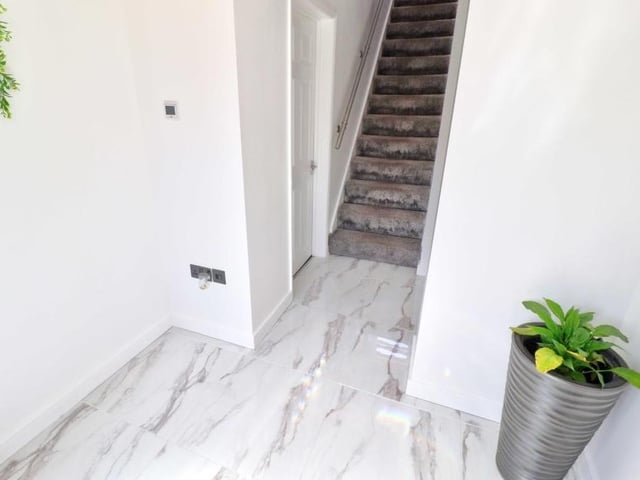 A return to the hallway (don't you just love that floor!) means it's time to go upstairs and check out three of the bedrooms.