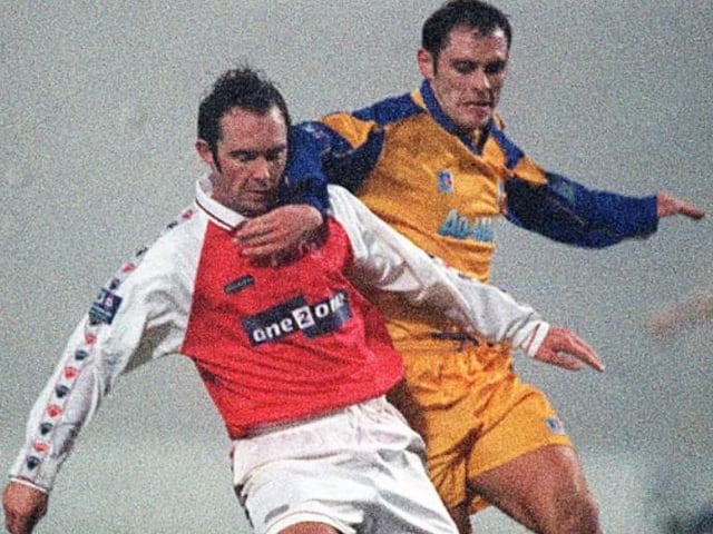 Mansfield's Mark Peters tackles Steve Thompson in 1999