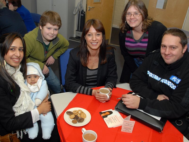 Ashfield MP Gloria De Piero, centre, held a surgery for local residents at Kirkby's Ashwood Centre. Gloria was joined at the event by Sgt. Carl Holland, right, from Neighbourhood Policing. They are pictured talking to local residents, from the left; Naznin Attan with 4 month old Aamir Mohammed, william Brown and mum Amanda Brown.