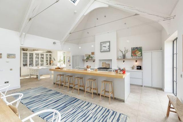 The kitchen is massive, bright and airy .