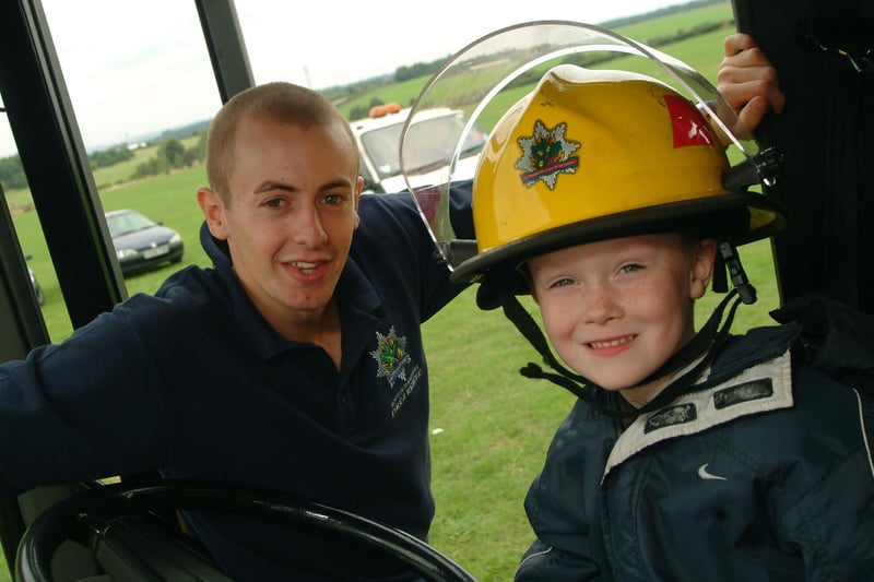 Worksop Fire Brigade - Matt Lloyd (firefighter) with Joshua Perkins (then aged five).