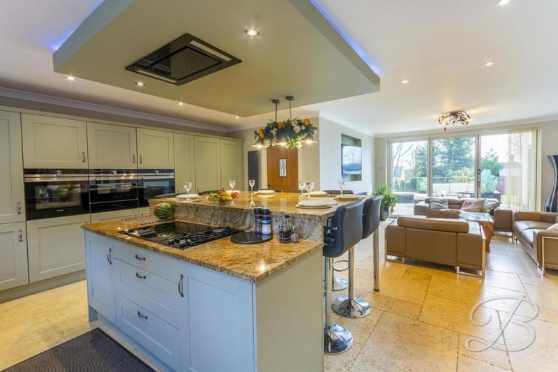 We begin our tour of the £750,000-plus property in the contemporary open-plan kitchen, which also has its own lounge. It boasts a range of integrated appliances and stylish shaker-style units and cabinets with complementary work surfaces over.