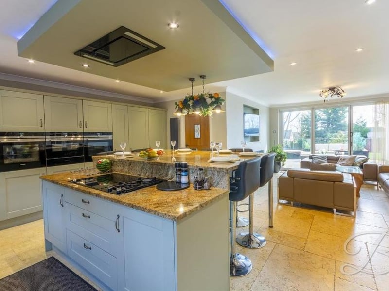 We begin our tour of the £750,000-plus property in the contemporary open-plan kitchen, which also has its own lounge. It boasts a range of integrated appliances and stylish shaker-style units and cabinets with complementary work surfaces over.