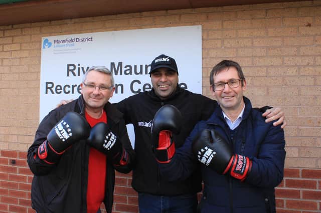 Award-winning community worker and boxing coach Marcellus Baz enjoys a playful sparring session with Mansfield's mayor, Andy Abrahams (right), and Coun Andy Burgin, of Mansfield District Council.