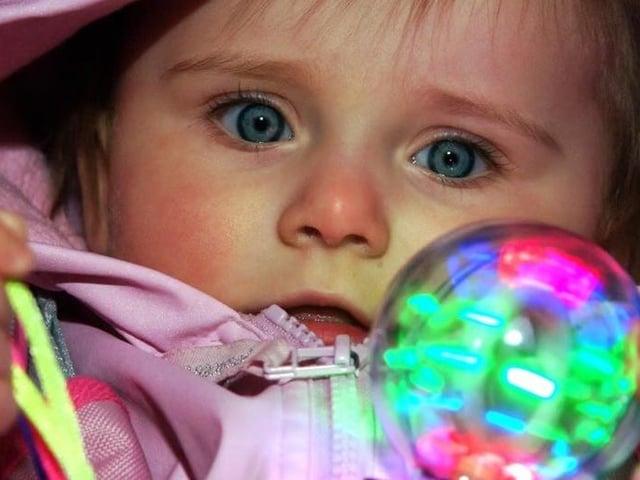 11-month-old Josephine Taylor, from Mansfield Woodhouse, is mesmerised by her toy light ball at a Mansfield bonfire display back in 2006