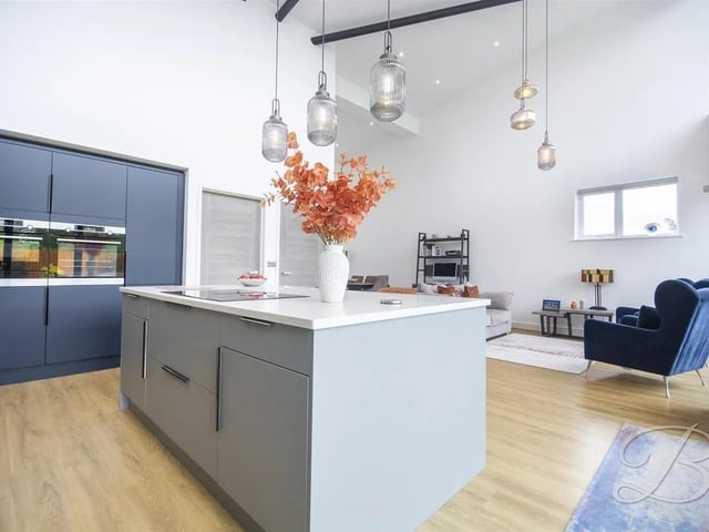 At the heart of the property is a stunning and generously proportioned open-plan kitchen, living and dining area