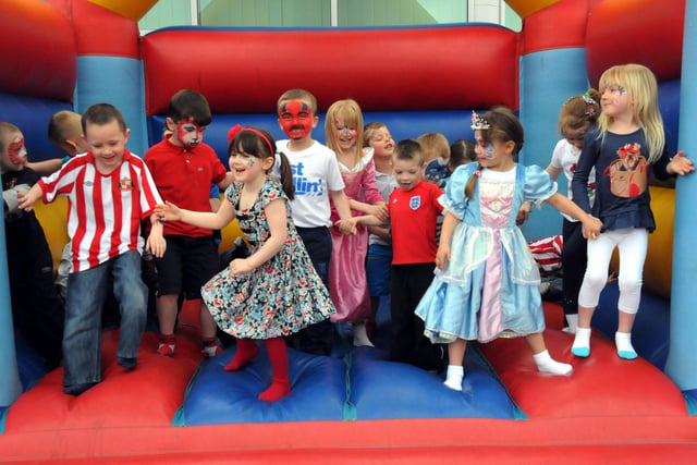 It's party time.... Key Stage 1 pupils from Southwick Primary School have fun on one of three bouncy castles, brought in as part of the party to celebrate the Royal wedding in 2011.