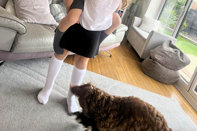 George enjoys a moment with his twin sister.