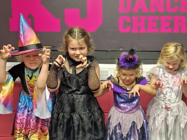 A group of witches ready for Halloween fun.