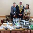Sutton Rotary Club president Danny Thompson presents valuable cooking equipment to Karen Draycott, tutor at the ATTFE Let's All Eat food-bank.