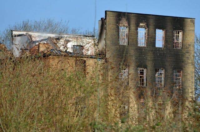 The historic Hermitage Mill building left in ruins after the fire