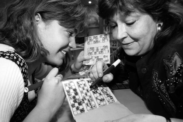 Kate Omrod aged 21 and Fran Steel aged 43, play bingo at the Top Rank club in Portsmouth, 1995. The News PP4465