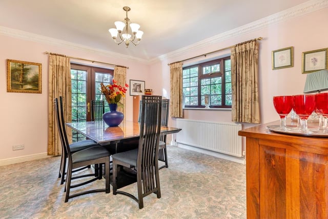 Next stop on our tour of Four Oaks is the charming dining room, which has a patio door that leads out to the gardens at the side and rear of the house.
