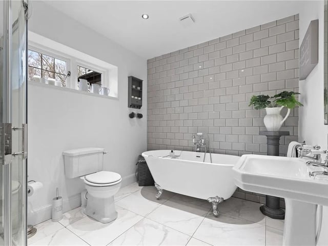 The family bathroom features a white four piece suite comprising of shower cubicle, freestanding bath, WC, wash basin, part tiled walls and tiled flooring, double glazed window to the rear aspect and a heated chrome towel rail.