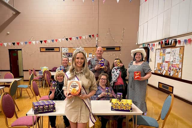 Nikita Wilson with members of COSH following an Easter Egg appela
