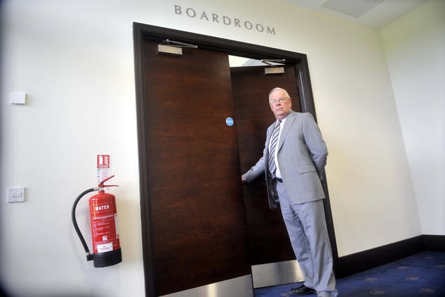 Chairman Barry Hubbard opens the doors to the new boardroom.