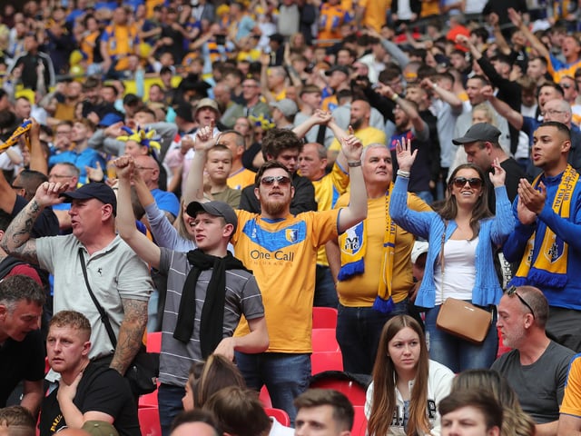 Mansfield Town fans watch the drama unfold inside Wembley